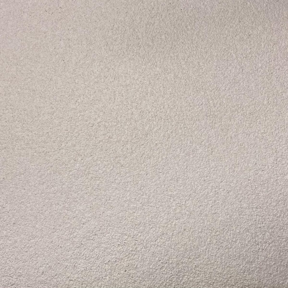 Floxxan Flüssigtapete in Apricot neu - feine textile Struktur für edle Wandgestaltung im Wohnzimmer.